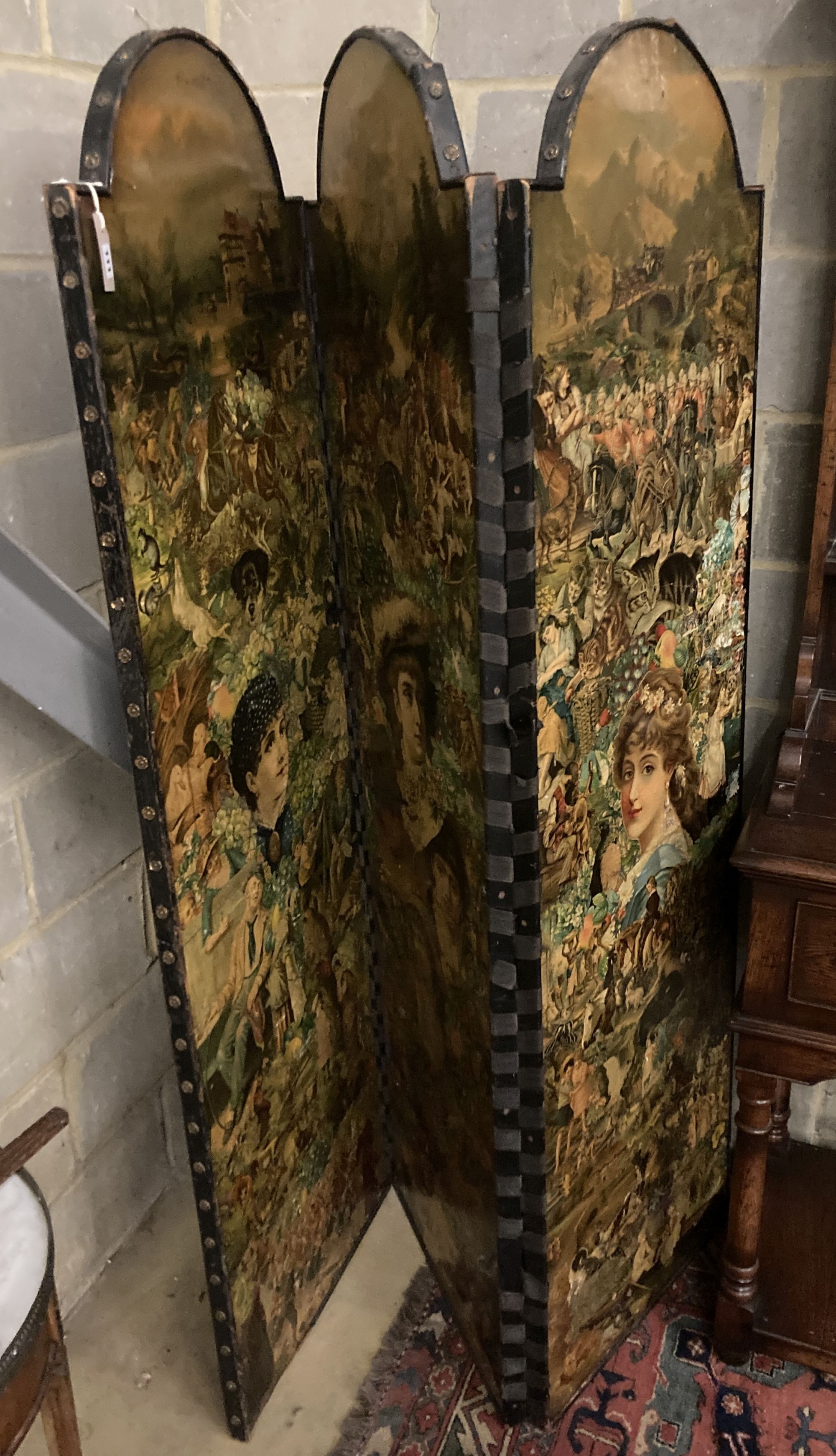 A Victorian three-fold decoupage screen, each panel with arched top, depth 53cm, height 183cm with arched top